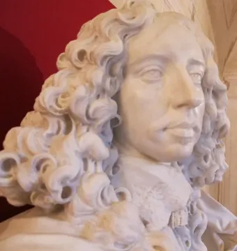 Marble bust of Francesco I d\'Este with curled hair and a lace collar.