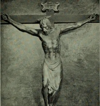 Santa Croce Crucifix showing a wooden Christ figure on the cross with bowed head, halo, loincloth, and INRI plaque above.