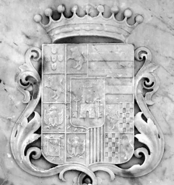 Ornate coat of arms carved in stone on the Count of Porto Alegre monument.