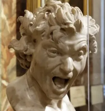 Damned Soul by Gian Lorenzo Bernini, a white marble bust with a screaming anguished face and wild curly hair behind glass.