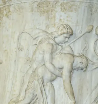 Marble relief from the Borghese Vase showing two figures, one standing and supporting a limp draped figure with a staff behind them.