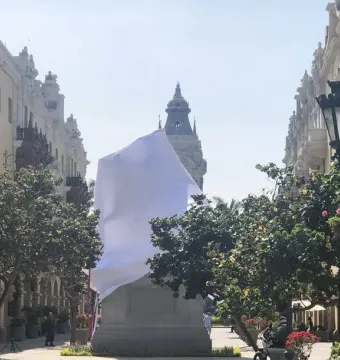 Francisco Pizarro Equestrian Statue covered with a white sheet on a stone base in a public plaza.