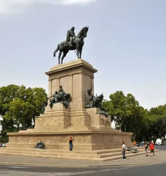 Giuseppe Garibaldi equestrian statue on a large stone pedestal in a public square