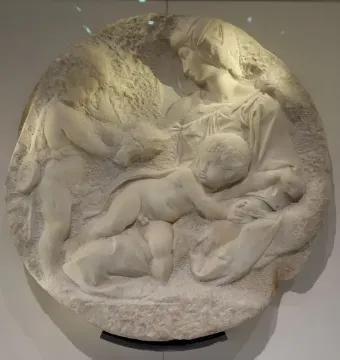 Taddei Tondo marble relief showing the Virgin and two children