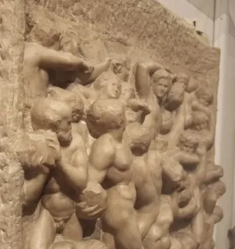 Battle of the Centaurs marble relief showing a dense struggle of nude, muscular figures