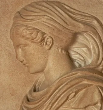 Gradiva relief showing a woman\'s head and upper torso in profile, looking downward.