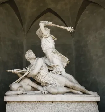 Winkelried Memorial marble sculpture showing two male figures in a dramatic struggle, one poised to strike a prone figure holding arrows.