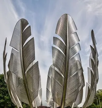 Kindred Spirits sculpture with tall metallic feathers in a circular arrangement.
