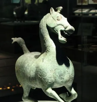 Flying Horse of Gansu bronze sculpture poised on one rear hoof atop a bird figure