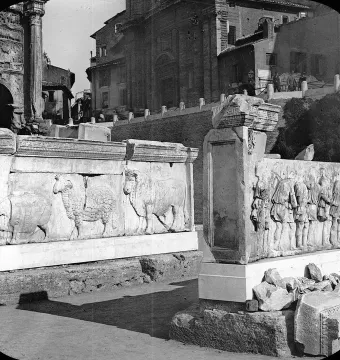 Two marble relief slabs from the Plutei of Trajan, one carved with animals and the other with robed figures.