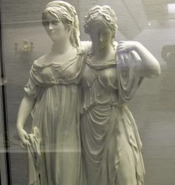 Princesses Monument showing two women in flowing classical drapery, one resting her arm on the other’s shoulder.