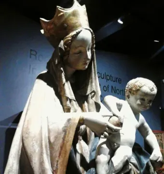 Beautiful Madonna of Wrocław statue of a crowned woman holding a child, with the child grasping a spherical object.