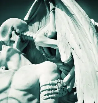 The Kiss of Death sculpture showing a winged skeletal figure kissing the forehead of a recumbent human figure.