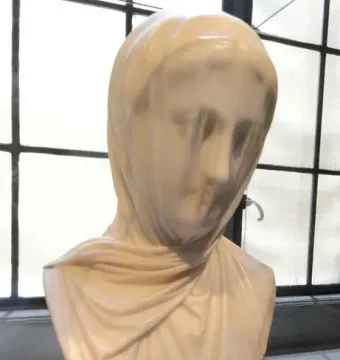 The Veiled Nun marble bust with a translucent carved veil covering the face and shoulders.