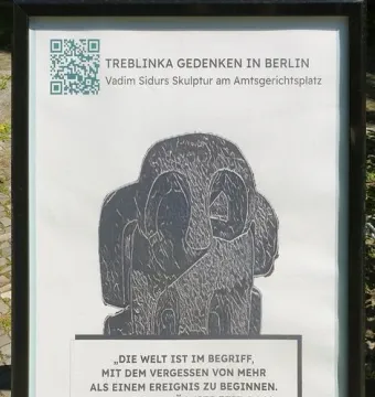 Framed Treblinka Gedenken sign with a dark abstract sculpture image and QR code