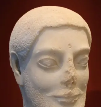 Sabouroff Head, a white marble sculpture of a bearded male head with short textured hair and almond-shaped eyes.