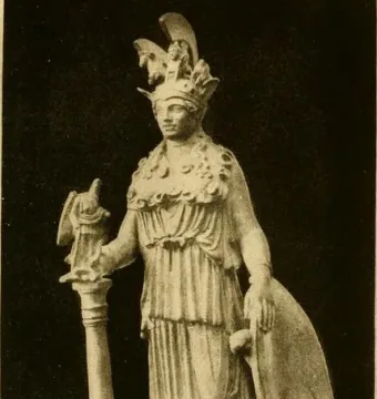 Varvakeion Athena statuette showing a standing armored figure with helmet, shield, and a small figure atop a tall support.