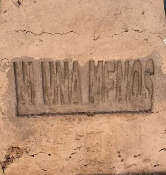 Close-up of the Antimonumenta base with the phrase \