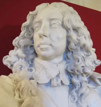 Bust of Francesco I d\'Este in white marble, with curly hair, a mustache, and a lace collar.