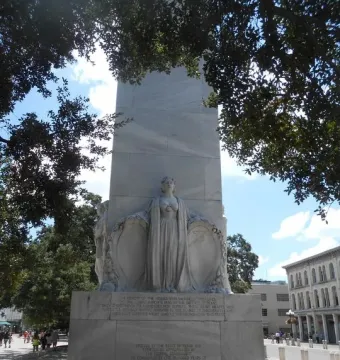 Alamo Cenotaph stone monument with a central relief sculpture and inscriptions on the base.
