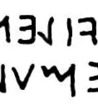 Upside-down inscription on the Stele of Avile Tite, shown as two lines of dark ancient characters on a white background.