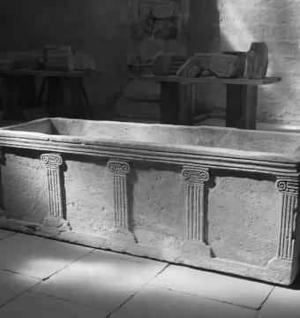Stone sarcophagus of Louis the German with fluted pilasters and Ionic capitals on its side