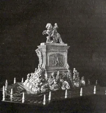 Golden Rider equestrian statue model with a rider on a rearing horse atop an ornate pedestal