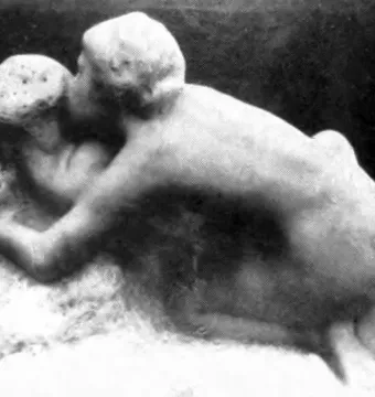 Metamorphoses by Auguste Rodin, showing two intertwined figures in a monochrome sculpture.