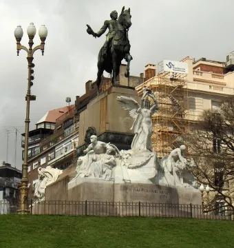 Bartolomé Mitre Monument with an equestrian sculpture atop a tall stone base, flanked by carved figures below.