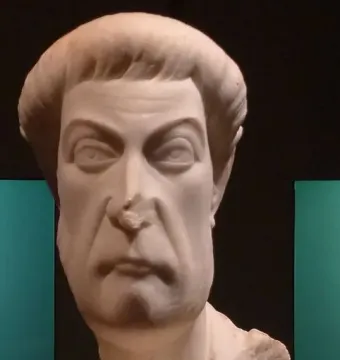 Marble bust of Eutropius with a stern face, short hair, and a short beard.
