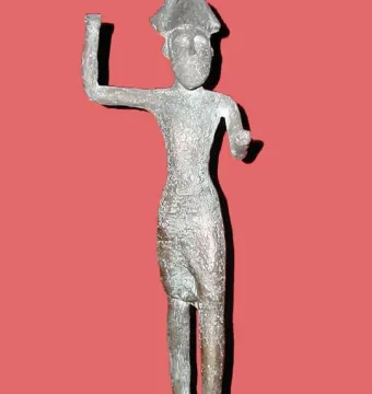 Melqart di Sciacca figurine with a pointed headdress and raised arm