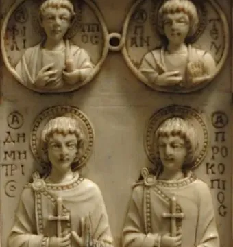 Harbaville Triptych relief carving showing two haloed standing saints holding crosses beneath two busts in round medallions.