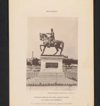 The Marqués del Duero equestrian statue stands on a decorated plinth behind a low iron fence in Madrid.