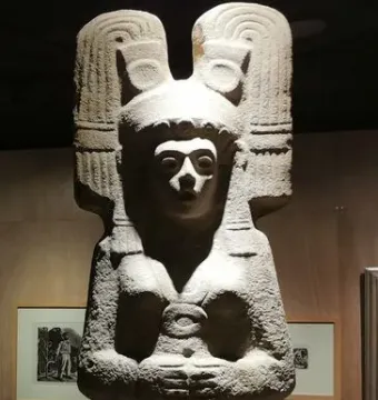 The Young Woman of Amajac statue with an ornate headdress and carved garment details.