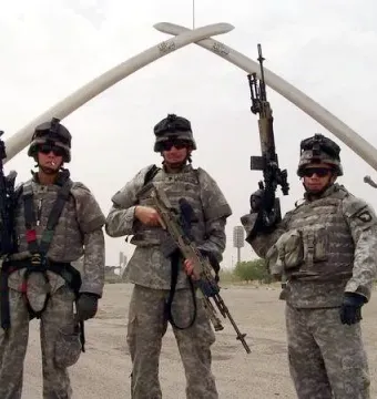 The Victory Arch in Baghdad, two giant crossed swords held by sculpted arms.