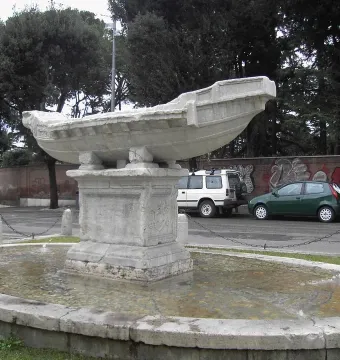 Fontana della Navicella stone boat fountain with water flowing into an oval basin