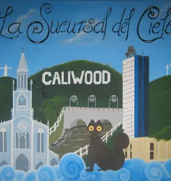 El Gato del Río depicted as a dark cartoon cat with yellow eyes and swirling whiskers, sitting on blue and white clouds.