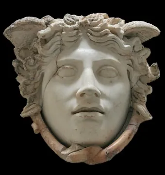 Medusa Rondanini marble head with closed eyes, wavy hair, and snake-like forms around the lower face.