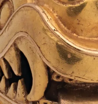 Serpent Labret with Articulated Tongue showing a polished golden serpent snout, teeth, and fangs.