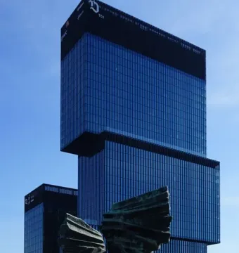 Silesian Insurgents\' Monument in front of modern glass skyscrapers in Katowice