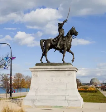 Tadeusz Kościuszko Monument, a bronze equestrian statue on a stone pedestal with a raised sword.