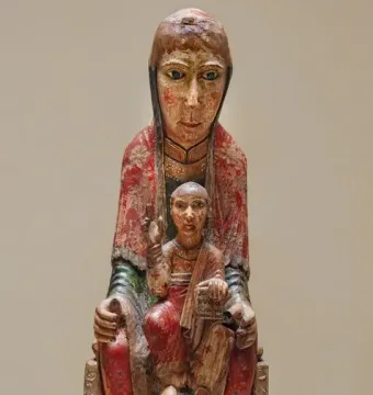 Virgin from Ger, a painted wooden Madonna and Child sculpture with faded red and yellow pigments.