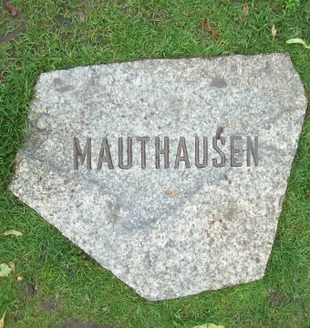Light grey stone slab inscribed with \