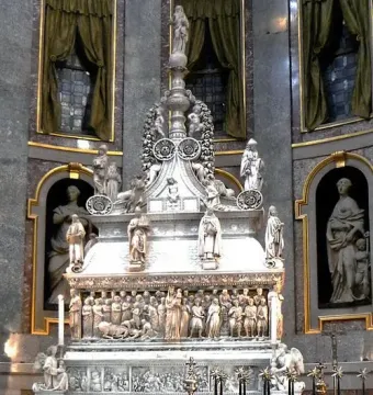 Arca di San Domenico, a richly carved marble monument with figures and reliefs inside a church interior