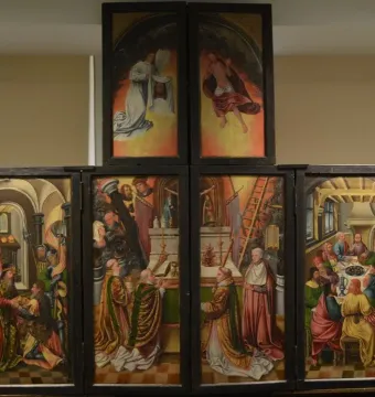 Fisenne Altarpiece with six painted panels in a dark wooden frame