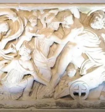 Proserpina Sarcophagus with a high-relief marble carving of a dramatic mythological scene with horses, a chariot, and a serpent.