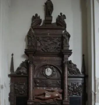Tomb of Lew Sapieha with a central armored reclining figure and smaller draped figures in a multi-tiered stone monument