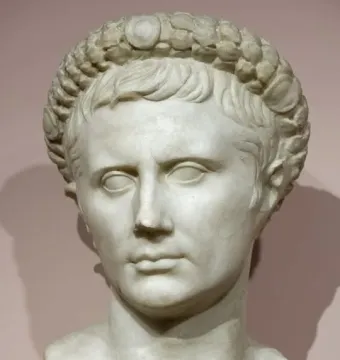 White marble bust of Augustus wearing a gemmed crown.