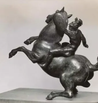 Rearing Horse and Mounted Warrior statuette showing a rearing horse with a mounted warrior on a rectangular base.