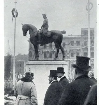 Equestrian Monument of Frederick the Great on a tall pedestal, with formally dressed men gathered in the foreground.